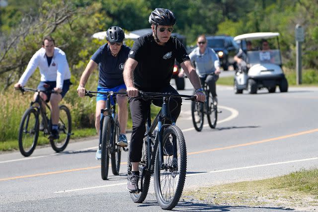 <p>AP Photo/Susan Walsh</p> Joe Biden rides just ahead of his son, Hunter Biden, at Gordons Pond State Park on June 1