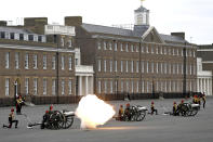 Members of the King's Troop Royal Horse Artillery fire a 41-round gun salute at Woolwich Barracks, to mark the death of Prince Philip, in London, Saturday, April 10, 2021. Britain's Prince Philip, the irascible and tough-minded husband of Queen Elizabeth II who spent more than seven decades supporting his wife in a role that mostly defined his life, died on Friday. (Daniel Leal-Olivas/Pool Photo via AP)