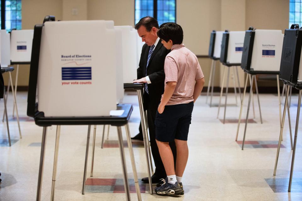 John Cranley, former Cincinnati mayor and democratic candidate for Ohio governor, votes in the primary, Tuesday, May 3, 2022. He was at the Knox Presbyterian Church in Hyde Park with his son, Joseph, 13, and his wife, Dena. 