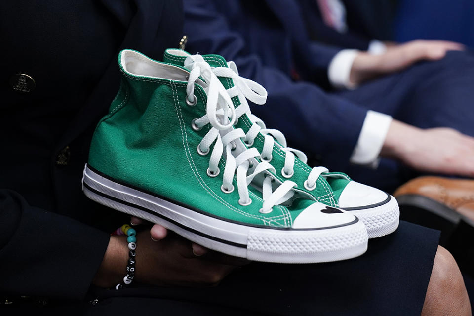 Camila Alves McConaughey holds the lime green Converse tennis shoes that were worn by Uvalde shooting victim Maite Yuleana Rodriguez, 10, at a White House press briefing in Washington, Tuesday, June 7, 2022. - Credit: AP