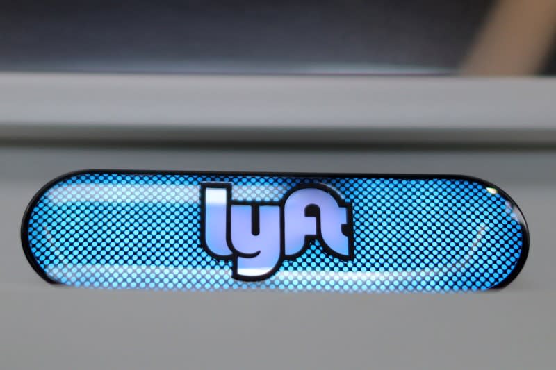 FILE PHOTO: A Lyft logo is seen in the Driver Hub in Los Angeles