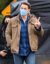 <p>John Cena flashes a peace sign on the set of <em>The Peacemaker</em> on Tuesday in Vancouver.</p>