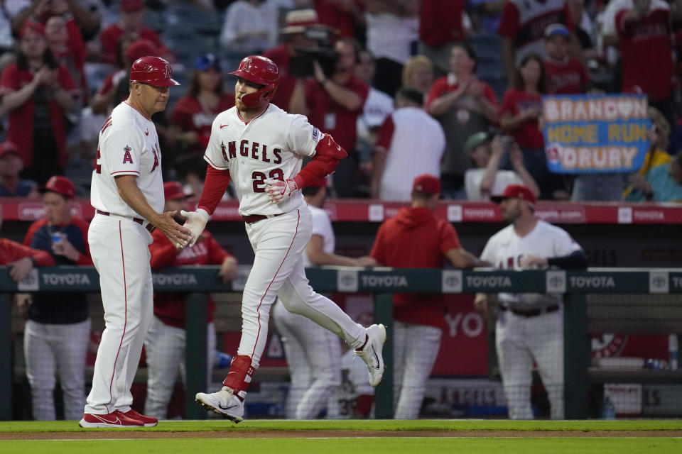Los Angeles Angels' Brandon Drury (23) runs the bases after hitting a home run during the first inning of a baseball game against the Texas Rangers in Anaheim, Calif., Tuesday, Sept. 26, 2023. Randal Grichuk and Zach Neto also scored. (AP Photo/Ashley Landis)