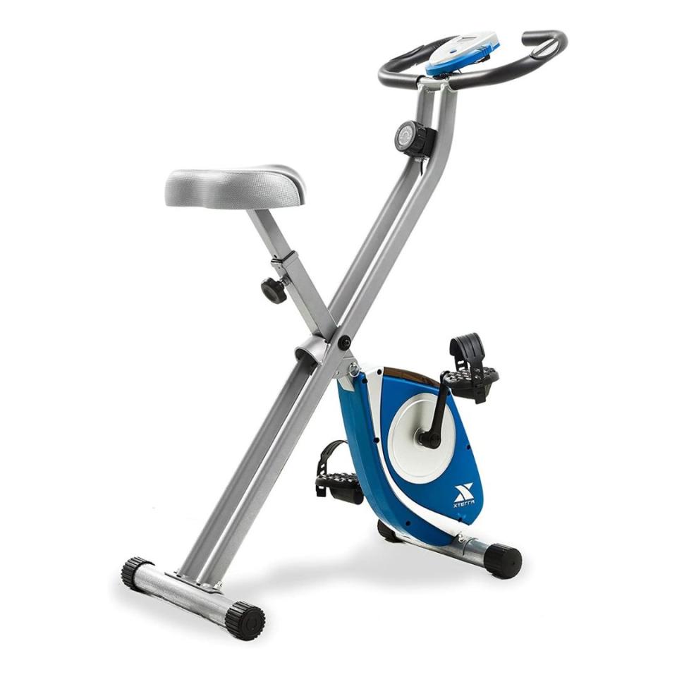 Save space with this sturdy exercise bike that can be folded up and put away when it's not in use. The LCD screen displays speed, distance, time, calories and pulse rate.You can buy the Xterra folding exercise bike from Amazon for around $107.