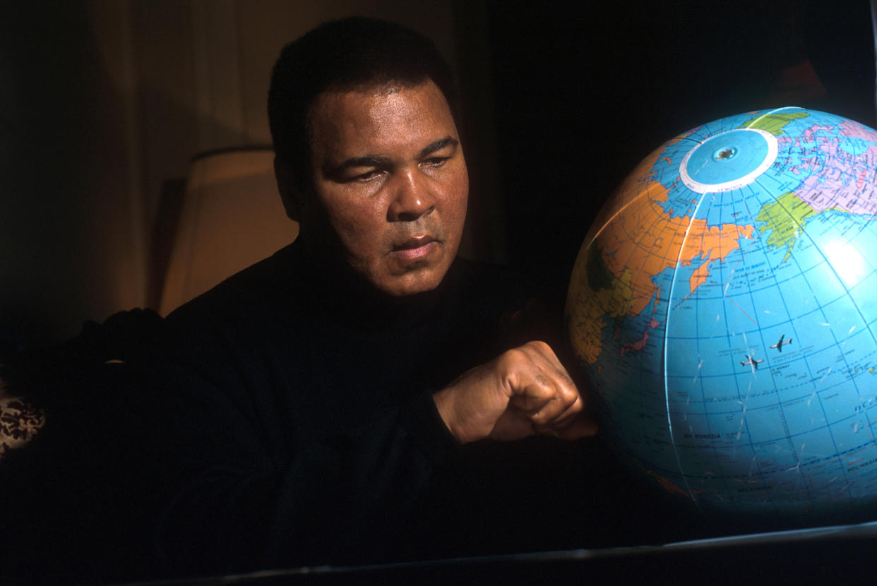 ROME, ITALY - FEBRUARY 06:  Muhammad Ali punches a globe at the Plaza Hotel on February 6, 2001 in Rome, Italy. The great career of the most famous American boxer is highlighted by an Olympic gold medal in light- heavyweight at the Rome 1960 Games and three World Heavyweight Champion titles. Ali was also crowned Sportsman of the Century by Sports Illustrated and the BBC.  (Photo by Franco Origlia/Getty Images)