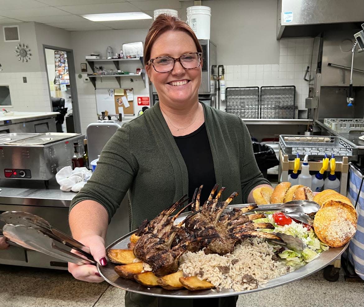 Danielle Shaheen displays an Arabic platter, the top-selling dish at Desert Inn in northwest Canton.