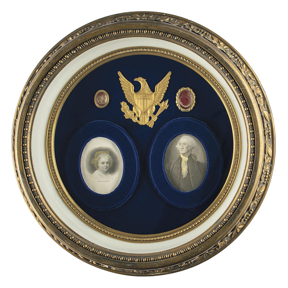 This undated photo released by RR Auction shows a shadowbox display featuring locks of hair from the heads of the first United States President George Washington, top right, and from his wife Martha, top left, up for auction between Feb. 11-18, 2021, by the Boston-based auction firm. (Nikki Brickett/RR Auction via AP)