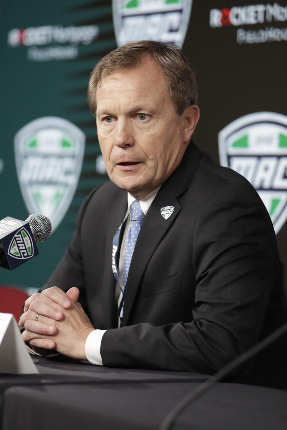 Mid-American Conference Commissioner Jon Steinbrecher speaks to the media Thursday, March 12, 2020, in Cleveland. The Mid-American Conference men's basketball tournament was cancelled at an arena scheduled to be the site of NCAA men's tournament games next week. (AP Photo/Tony Dejak)