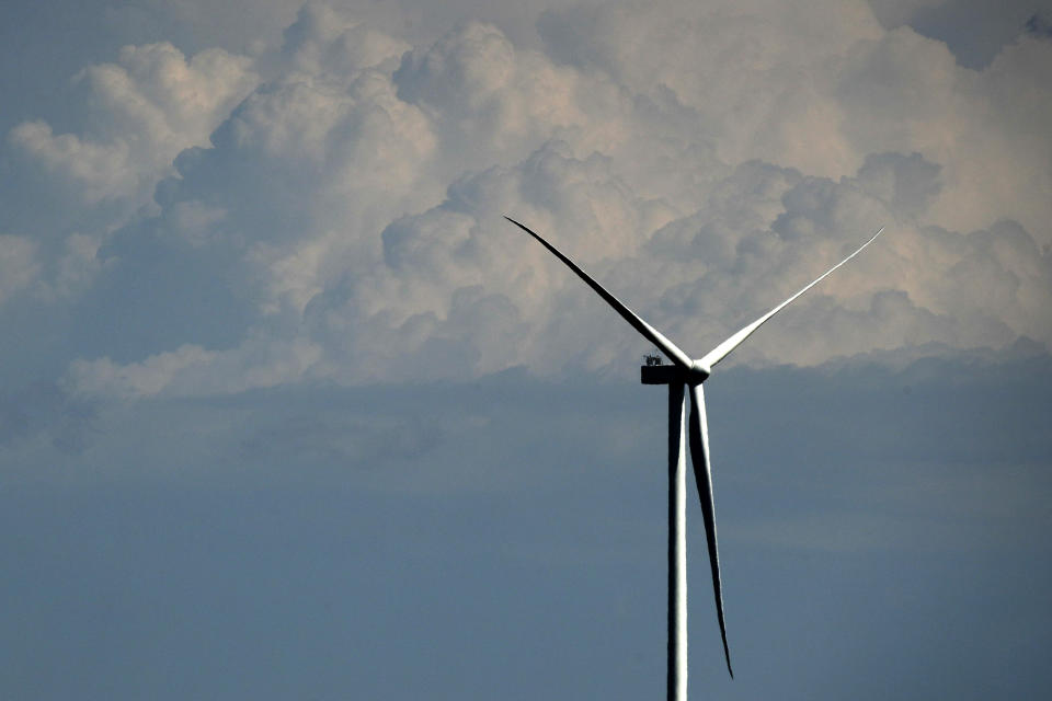A wind turbine stands against stormy skies at the Reading Wind Facility in Reading, Kan., on Monday, April 27, 2020. Although, the wind power project has experienced some delays in delivery of some foreign-sourced parts and had to implement social distancing measures, the project is on schedule to be completed in the next few weeks. (AP Photo/Charlie Riedel)
