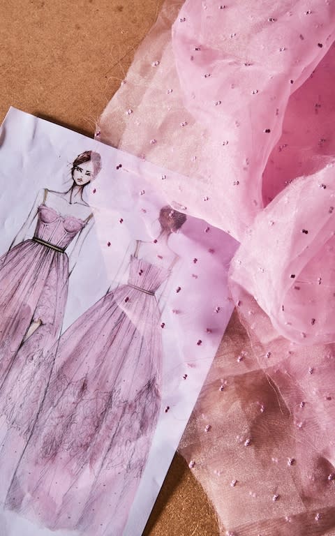 A sketch for one of Ermanno Scervino's typically feminine gowns, alongside the fabric used in its making - Credit: Matteo Imbriani