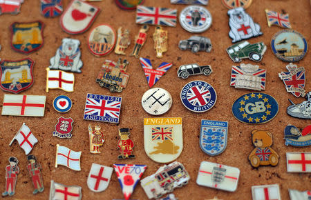 Pin badges are displayed for sale at a market stall in Great Yarmouth, Britain, March 21, 2018. REUTERS/Hannah McKay/Files