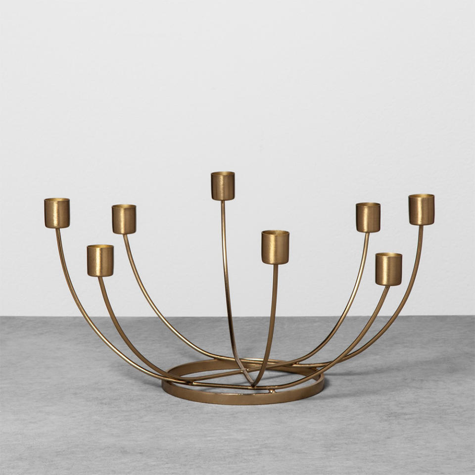 <p>Whether this brass beauty ends up on the dining table or coffee table, it will light up the room. The 8-candle centerpiece is a decorative must-have that can be used year-round.<br><strong><a rel="noopener" href="https://fave.co/2PWzOZX" target="_blank" data-ylk="slk:SHOP IT;elm:context_link;itc:0;sec:content-canvas" class="link ">SHOP IT</a>:</strong> $13 (on sale, $9),<a rel="noopener" href="https://fave.co/2PWzOZX" target="_blank" data-ylk="slk:target.com;elm:context_link;itc:0;sec:content-canvas" class="link "> target.com</a> </p>