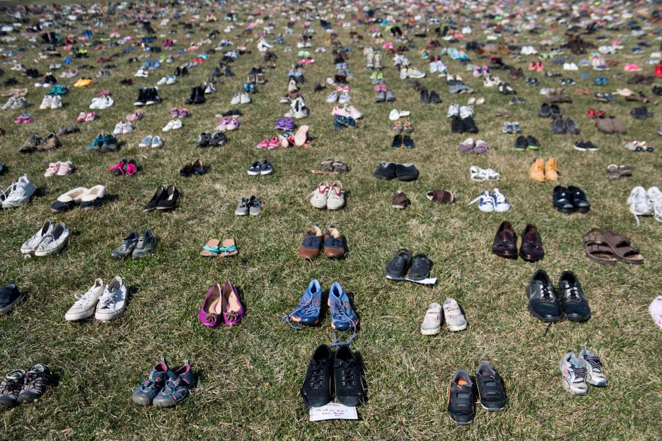 7,000 pairs of shoes are displayed on the grass outside the U.S. Capitol on March 13, 2018, to memorialize the children killed in gun violence since the Sandy Hook school shooting.<span class="copyright">Saul Loeb—AFP/Getty Images</span>