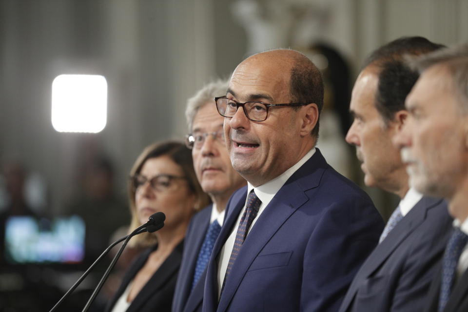 Italian Democratic Party Leader Nicola Zingaretti, center, talks to journalists, after meeting with Italian President Sergio Mattarella at Rome's Quirinale presidential palace, Wednesday, Aug. 28, 2019. Mattarella continued receiving political leaders to explore if a solid majority with staying power exists in Parliament for a new government that could win the required confidence vote. (AP Photo/Andrew Medichini)