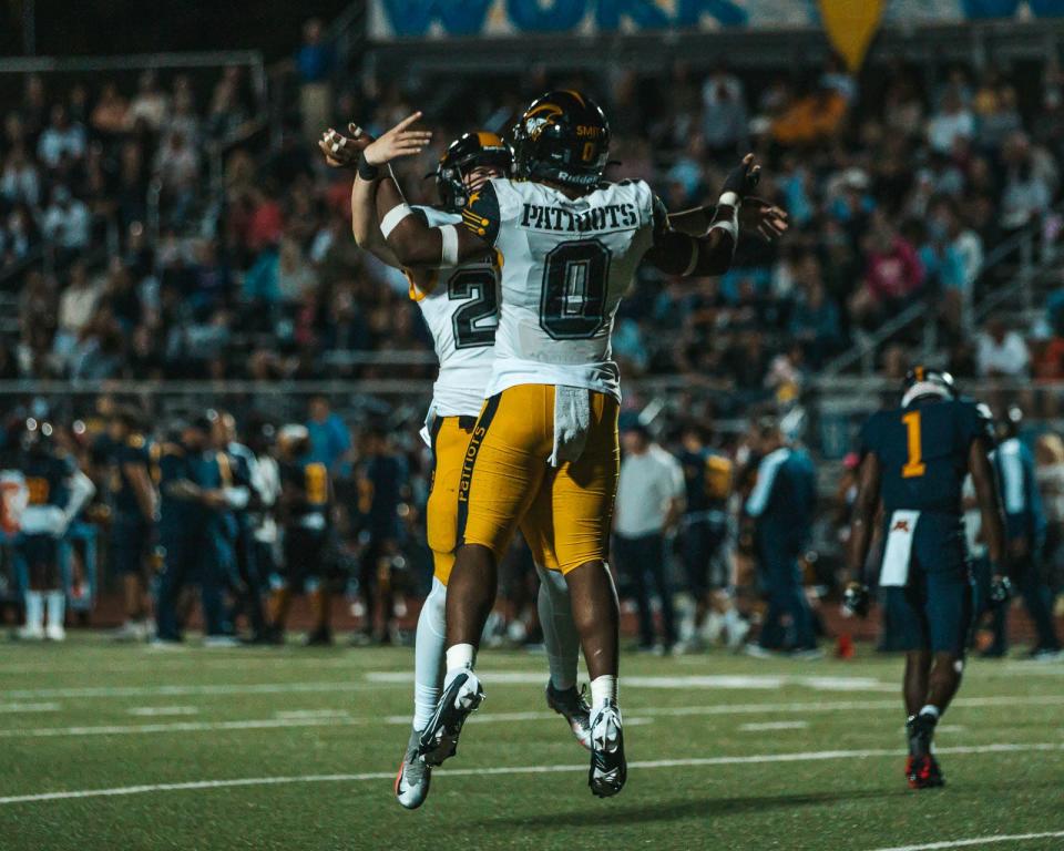 American Heritage celebrates a touchdown against Naples on Oct. 21, 2022.