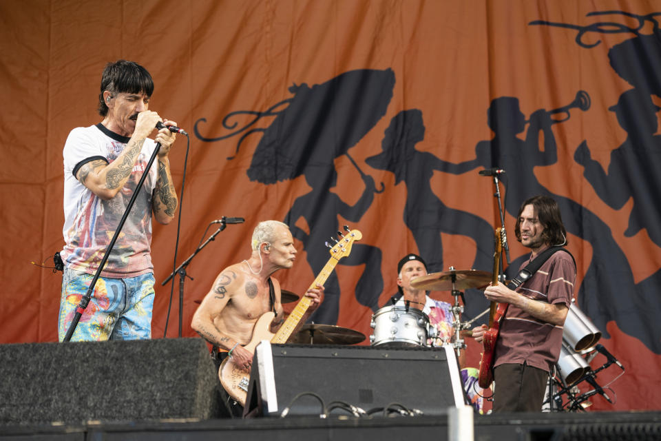 Anthony Kiedis, left, Flea, Chad Smith, and John Frusciante of the Red Hot Chili Peppers perform at the New Orleans Jazz and Heritage Festival, on Sunday, May 1, 2022, in New Orleans. (Photo by Amy Harris/Invision/AP)