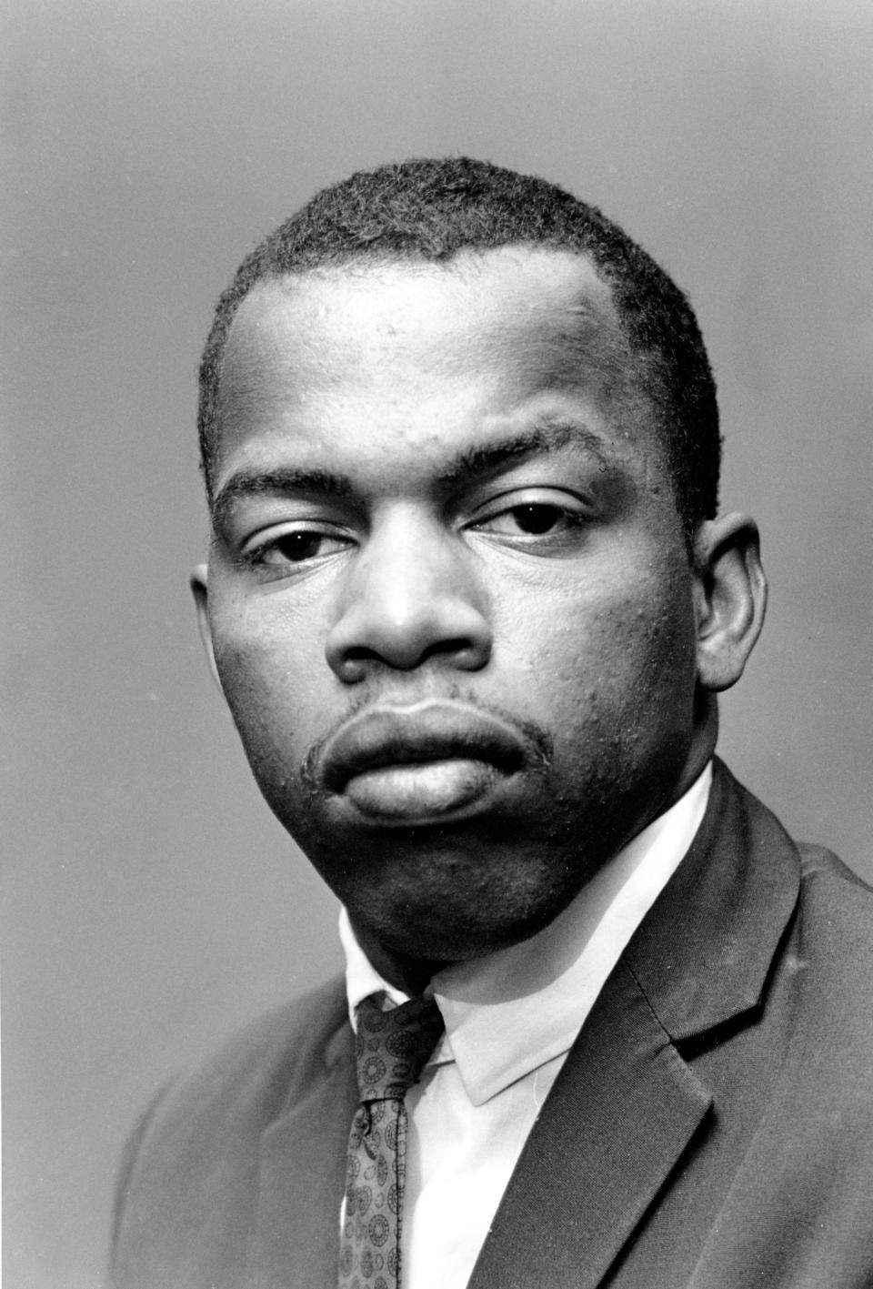 In this file photo, John R. Lewis, National Chairman of the Student Non-Violent Committee, poses at the National Urban League headquarters in New York City on Aug. 23, 1963.