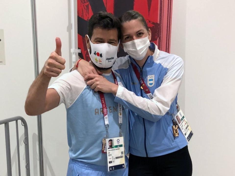 Argentine fencer Maria Belen Perez Maurice embraces coach Lucas Guillermo Saucedo after surprise proposal.