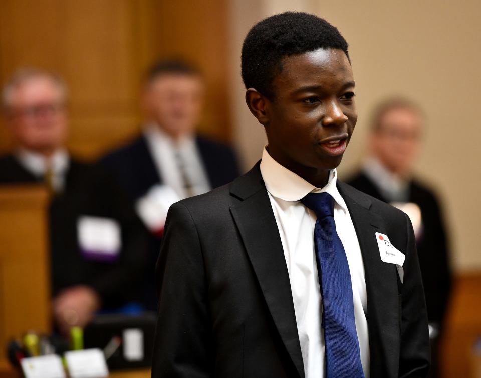 Douglas Nyarko-Amagyei says a few personal words to the courtroom as Forest Grove Middle School gets underway for a mock trial at the federal courthouse Monday evening.