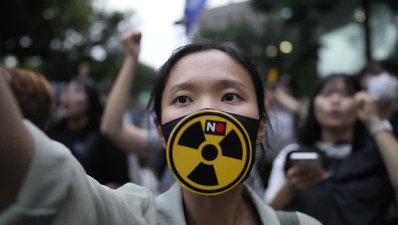 A member of environmental civic group shouts slogan during a rally to demand the withdrawal of the Japanese government’s decision to release treated radioactive water into the sea from the damaged Fukushima nuclear power plant, in Seoul, South Korea, Tuesday, Aug. 22, 2023. Japan will start releasing treated and diluted radioactive wastewater from the Fukushima Daiichi nuclear plant into the Pacific Ocean as early as Thursday — a controversial step that the government says is essential for the decades of work needed to shut down the facility that had reactor meltdowns 12 years ago.