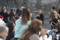 Designer Felipe Oliveira Baptista, center right, accepts applause at the conclusion of the Kenzo fashion collection during Women's fashion week Fall/Winter 2020/21 presented in Paris, Wednesday, Feb. 26, 2020. (AP Photo/Thibault Camus)