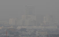 A thick layer of smog covers central Bangkok, Thailand, Monday, Jan. 20, 2020. Thick haze blanketed the Thai capital on Monday sending air pollution levels soaring to 89 micrograms per cubic meter of PM2.5 particles in some areas, according to the Pollution Control Department. (AP Photo/Sakchai Lalit)