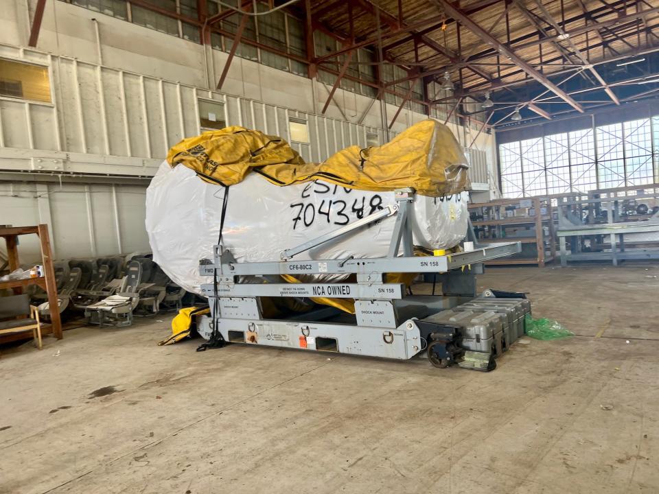 A covered engine inside a hangar at Pinal Airpark.