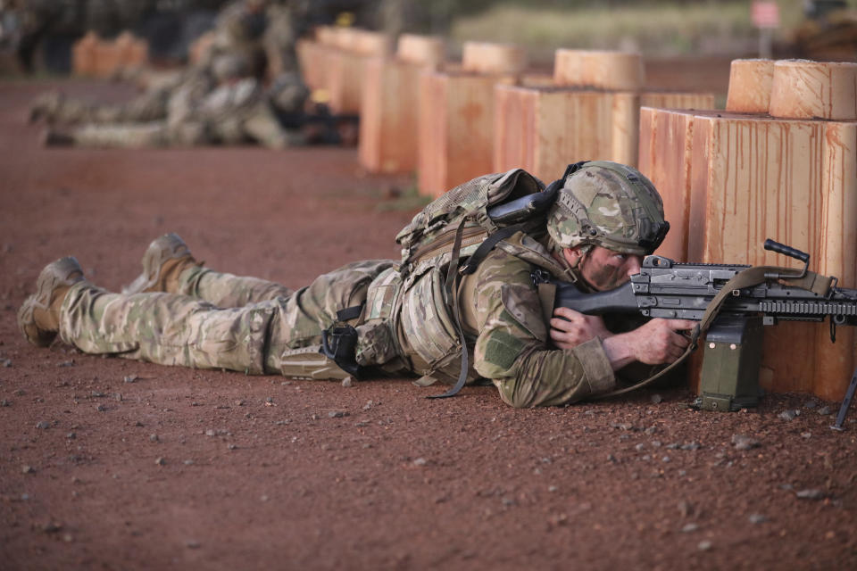 In this photo released by the U.S. Army, gunners assigned to 1163 Battery, 16th Field Regiment, Royal Regiment of New Zealand Artillery, provide comprehensive fire support to 3rd Infantry Brigade Combat Team, 25th Infantry Division, on Area X-Ray, Schofield Barracks, Hawaii, Nov. 2, 2023. In the largest-scale training held in Hawaii so far, more than 5,000 troops from the 25th Infantry Division, along with units from New Zealand, Indonesia, Thailand and Britain and supported by the U.S. Air Force, have been practicing fighting in an island jungle environment against an advanced enemy force, with exercises including paratrooper drops, a long range air assault, and re-supply by air and sea. (Sgt. Cera L. Rodney/U.S. Army via AP)