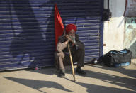 A Sikh farmer sits at Singhu, Delhi-Haryana border camp for protesting farmers against three farm bills, in New Delhi, India, Wednesday, Jan. 27, 2021. Tens of thousands of farmers who stormed the historic Red Fort on India’s Republic Day are again camped outside the capital after the most volatile day of their two-month standoff left one protester dead and more than 300 police officers injured. (AP Photo/Manish Swarup)