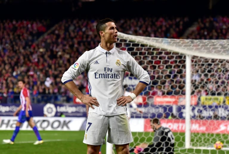 Real Madrid's forward Cristiano Ronaldo celebrates after scoring his third goal on November 19, 2016