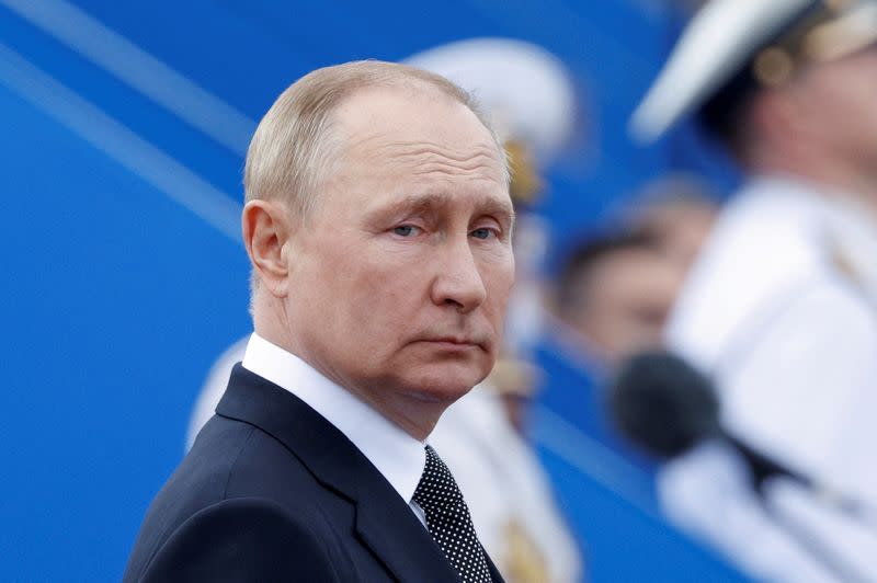 FILE PHOTO: Russia's President Vladimir Putin attends a parade marking Navy Day in Saint Petersburg, Russia