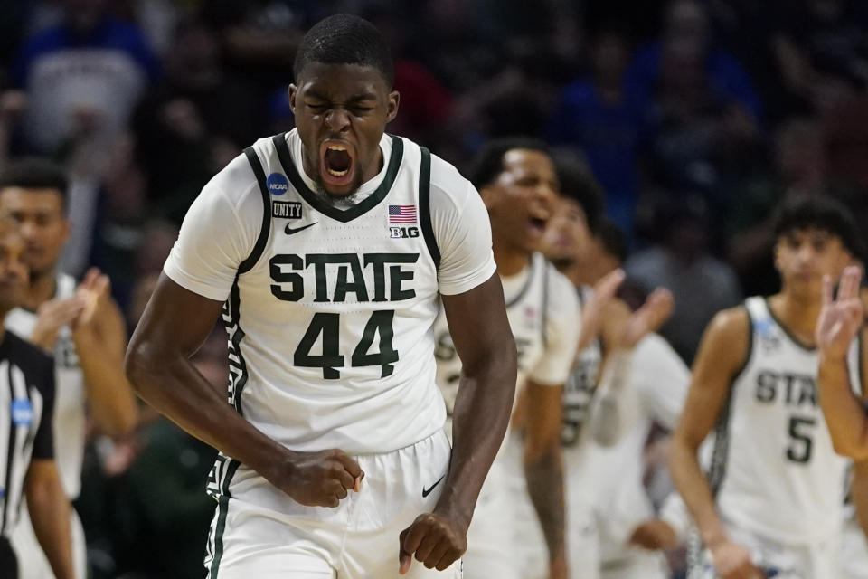 Michigan State forward Gabe Brown celebrates after scoring against Davidson during the second half of a college basketball game in the first round of the NCAA tournament on Saturday, March 19, 2022, in Greenville, S.C. (AP Photo/Chris Carlson)