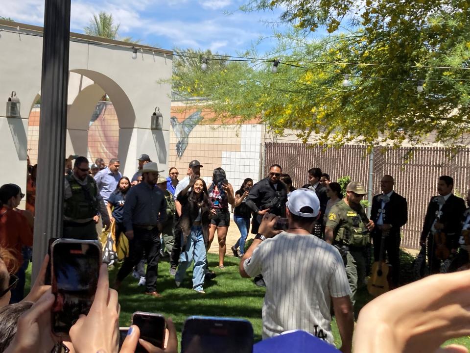 Pop star Becky G waves to the crowd at the Coachella Library on Saturday.