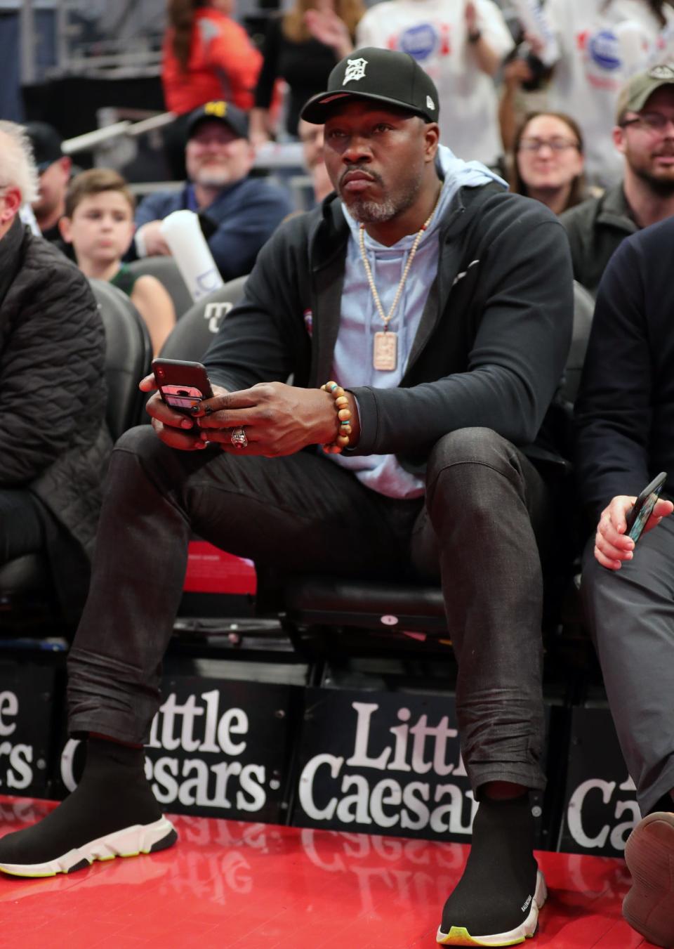 Ben Wallace sits courtside for a Pistons game against Oklahoma City on March 4, 2020 at Little Caesars Arena.