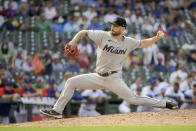 Miami Marlins relief pitcher Tanner Scott throws against the Chicago Cubs during the ninth inning of a baseball game, Sunday, Aug. 7, 2022, at Wrigley Field in Chicago. (AP Photo/Mark Black)