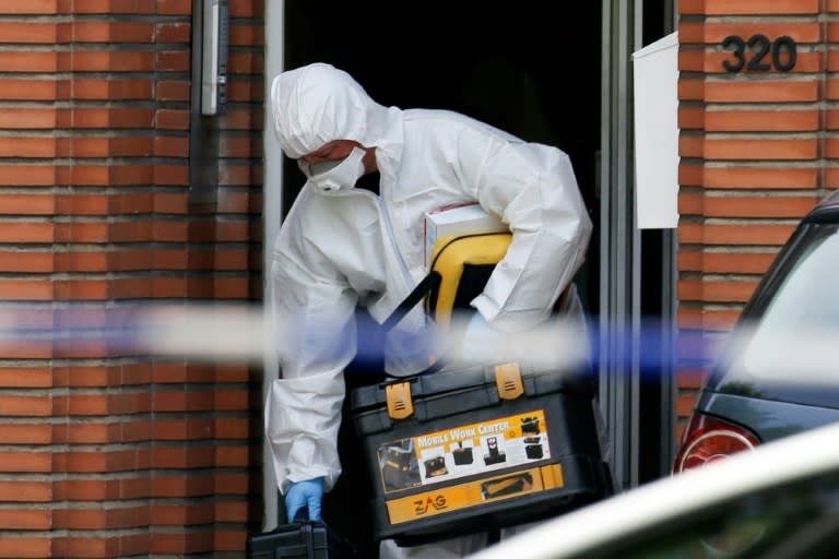 A forensic expert searches the house of the man who set off an explosion at one of Brussels' busiest railway stations in the neighbourhood of Molenbeek in Brussels, on June 21, 2017