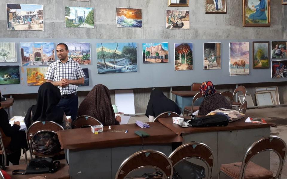 Afghanistan Artist, Abdul, standing in his art studio. Courtesy photo