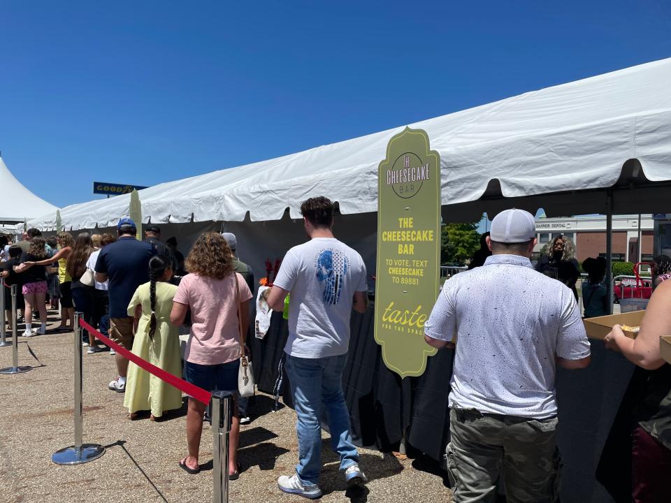 Community members line up to get a taste of The Cheesecake Bar's creations Saturday.