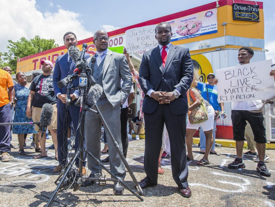 Attorneys Justin Bamberg, Chris Stewart and Dale Glover speak to the media in front of the Triple S Mart.