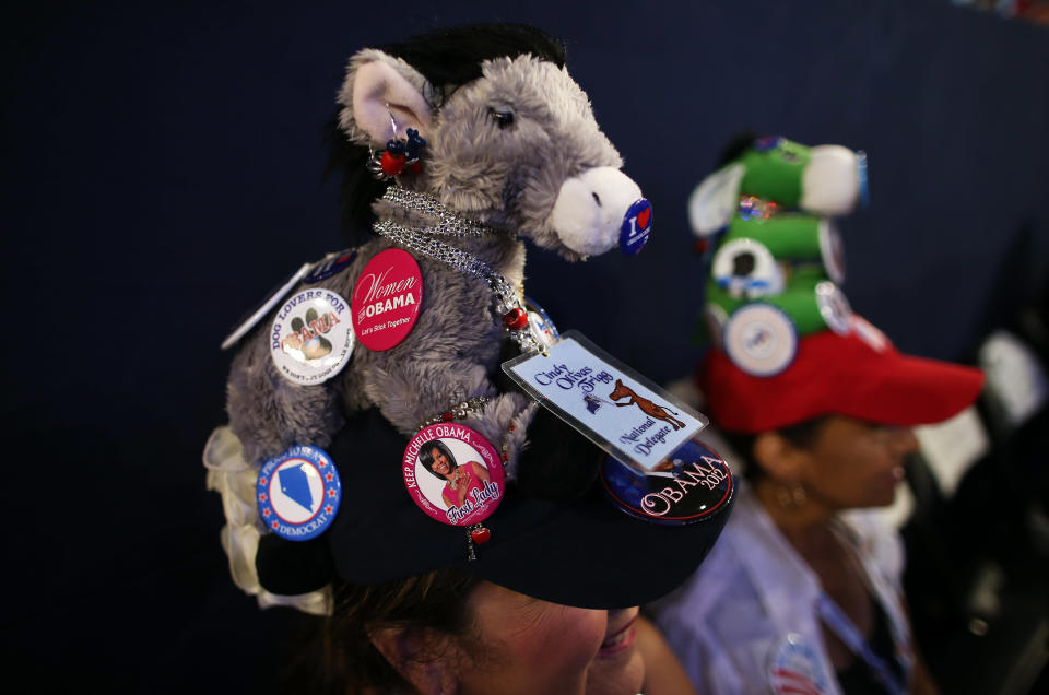 Cindy Trigg wears a hat decorated with a plush donkey and campaign buttons during the final day of the Democratic National Convention at Time Warner Cable Arena on September 6, 2012 in Charlotte, North Carolina. (Photo by Tom Pennington/Getty Images)