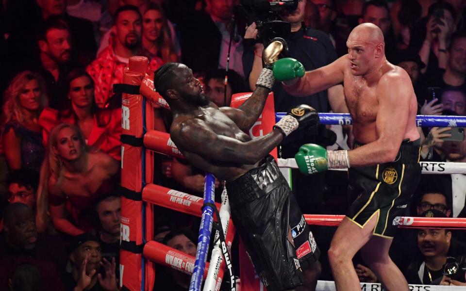 British boxer Tyson Fury (R) has US boxer Deontay Wilder against the ropes before defeating him in the seventh round during their World Boxing Council (WBC) Heavyweight Championship Title boxing match at the MGM Grand Garden Arena in Las Vegas on February 22, 2020 - AFP