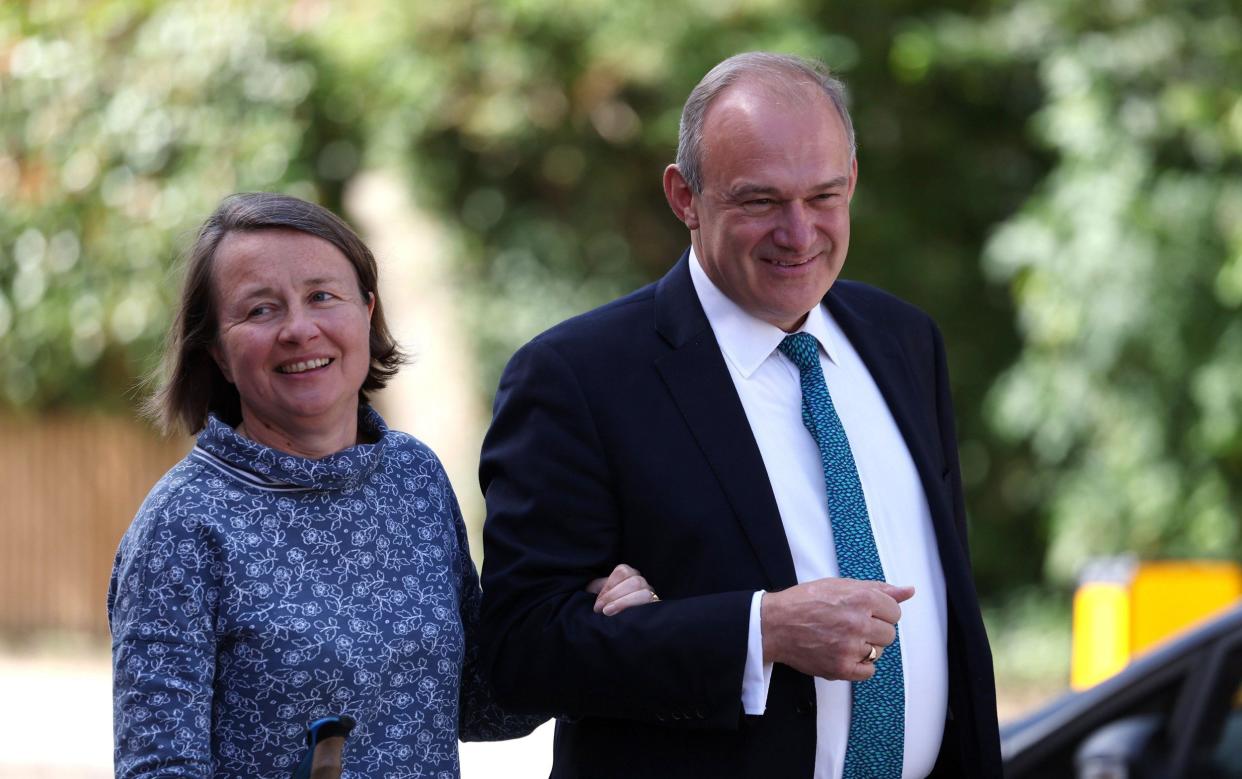 Sir Ed Davey, seen with with his wife Emily, is projected to lead as many at 61 Lib Dem MPs in the new Parliament