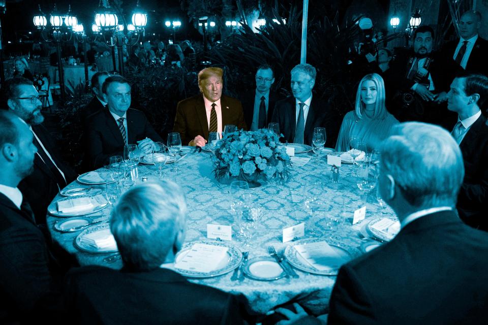 MARCH 7: President Donald Trump speaks with Brazilian President Jair Bolsonaro, left, during a diner at Mar-a-Lago in Palm Beach, Florida. Bolsonaro's press secretary tested positive for coronavirus days after taking part in meetings with Trump at Mar-a-Lago.