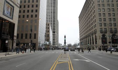 Magnificent Mile, usually bustling with traffic, stands empty as protesters march down Chicago's Michigan Avenue during a protest march against police violence in Chicago, Illinois December 24, 2015. REUTERS/Frank Polich