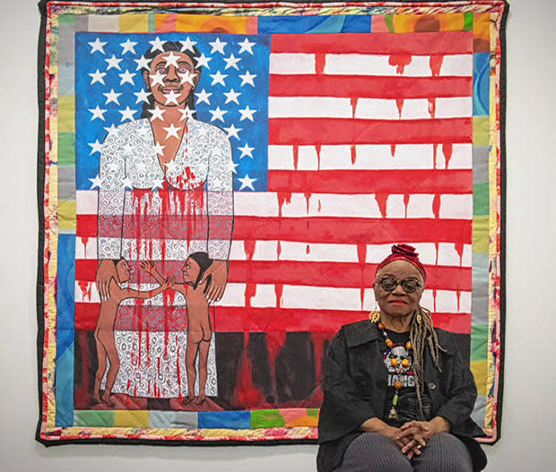 Faith Ringgold, pictured before her 1997 painting, 