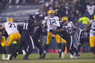 Green Bay Packers quarterback Aaron Rodgers (12) is hit during the second half of an NFL football game against the Philadelphia Eagles, Sunday, Nov. 27, 2022, in Philadelphia. (AP Photo/Matt Rourke)