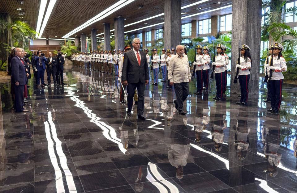 Cuban President Miguel Diaz-Canel, left, accompanies Brazilian President Luiz Inacio Lula da Silva during a visit to Revolution Palace, in Havana, Cuba, Saturday, Sept. 16, 2023. Lula is in Havana for the G77 + China summit. (AP Photo/Ramon Espinosa)