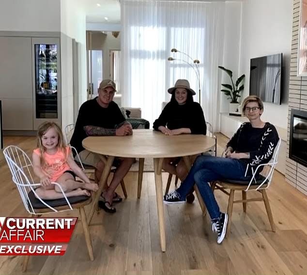 Jimmy, Tam and Emese sit at a dinner table in their house