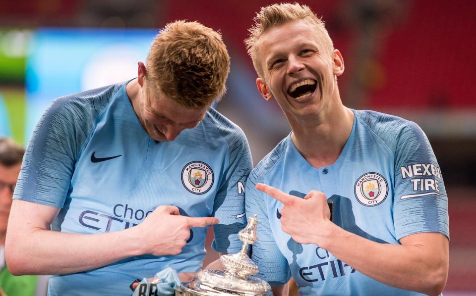 Kevin de Bruyne and Oleksandr Zinchenko with the FA Cup - Sebastian Frej/MB Media/Getty Images