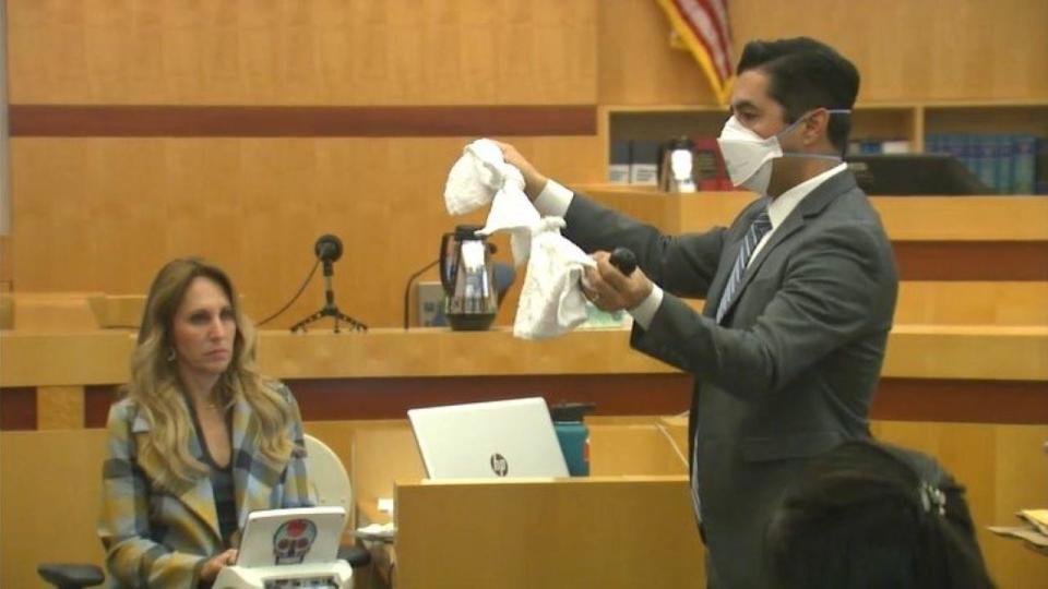 In court, Deputy DA Jorge Del Portillo holds up towels that were found in Jade Janks' SUV.    / Credit: CBS News